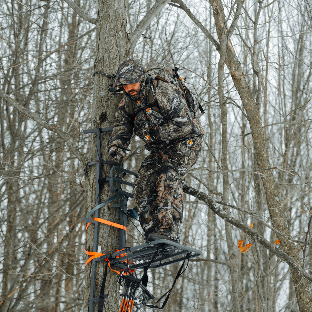 hunter wearing alpha elite in the tree stand